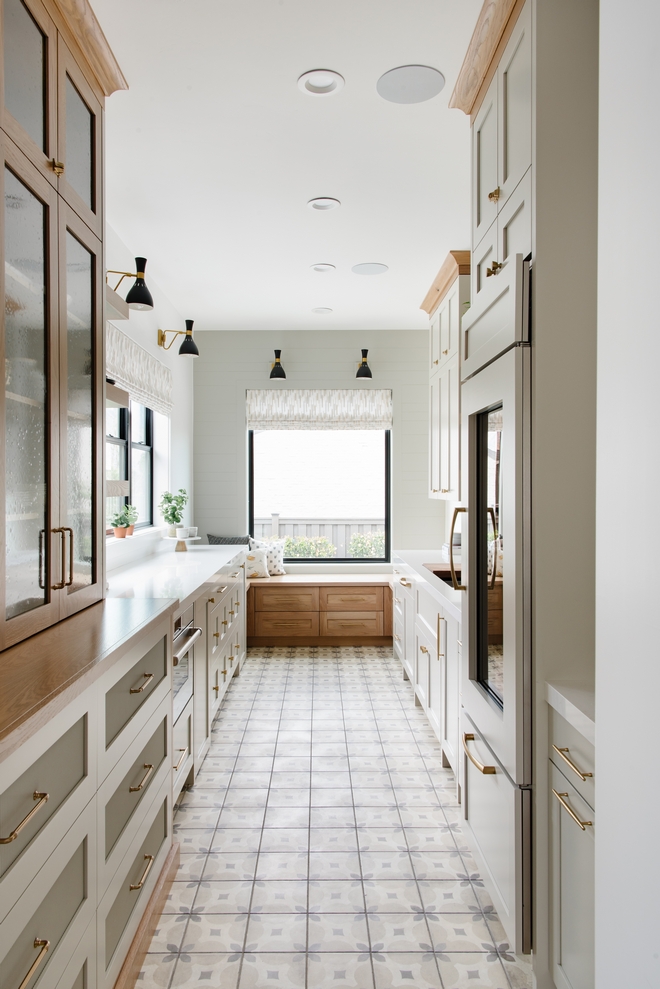 Butler's Pantry Design Tip In a narrow space such as this one keep the colors light and neutral but ground the space with pattern and then find something to add that draws your eye upward as well #ButlersPantry #ButlersPantryDesign #DesignTip #narrowspace #neutralcolor #neutral #pattern