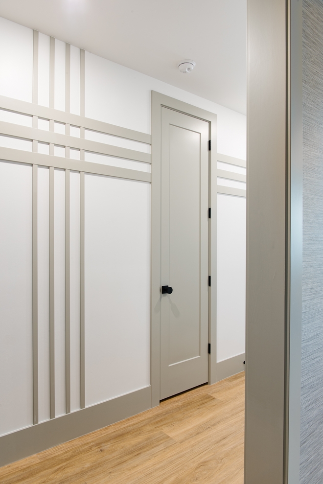 Hallway features custom wall trim Paint Grade MFF 3" and 1" Paint color Sherwin Williams SW 2844 Roycroft Mist Gray