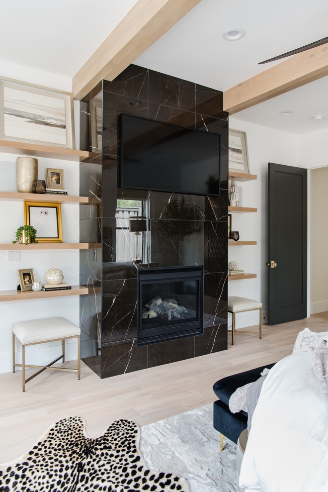 Floating White Oak shelves flank a floor-to-ceiling fireplace with black tiles while framed artwork on the top shelves mimic windows on both sides Floating White Oak shelves flank a floor-to-ceiling fireplace with black tiles while framed artwork on the top shelves mimic windows on both sides Floating White Oak shelves flank a floor-to-ceiling fireplace with black tiles while framed artwork on the top shelves mimic windows on both sides #FloatingWhiteOakshelves #floortoceilingfireplace #fireplace #blacktile #framedartwork