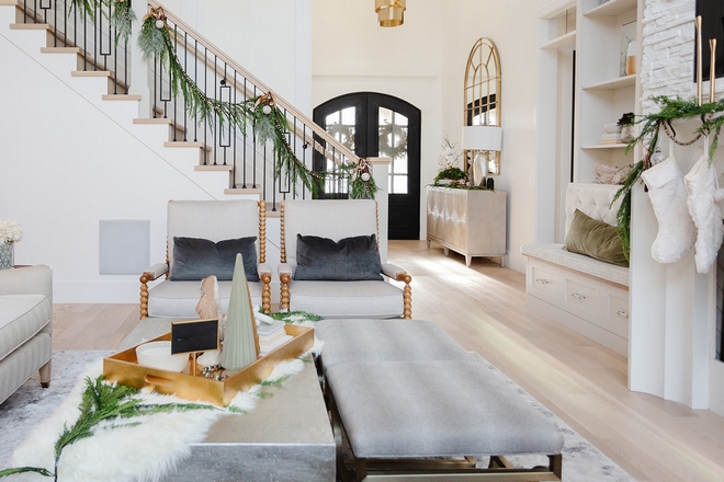 This home is stunning and it looks even more magical at this time of the year From this angle we get a nice look of the Foyer and the beautifully decorated staircase #Christmas #ChristmasDecor #ChristmasIdeas #ChristmasTour