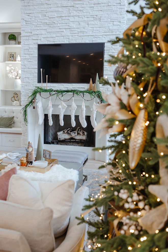 Christmas Mantel Faux Cedar garlands along with faux fur stockings are the focal point over the mantel #Christmas #ChristmasMantel #FauxCedargarland