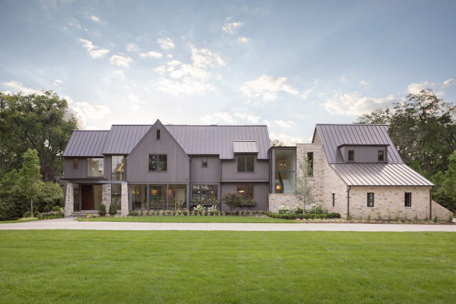 The exterior blends warm organic materials such as vertical cedar lap siding and natural stone with modern elements such as galvanized steel beams and a metal roof #exterior #organicmaterials #verticalcedarlapsiding #cedarlapsiding #naturalstone #modernelements #galvanized #steelbeams #metalroof