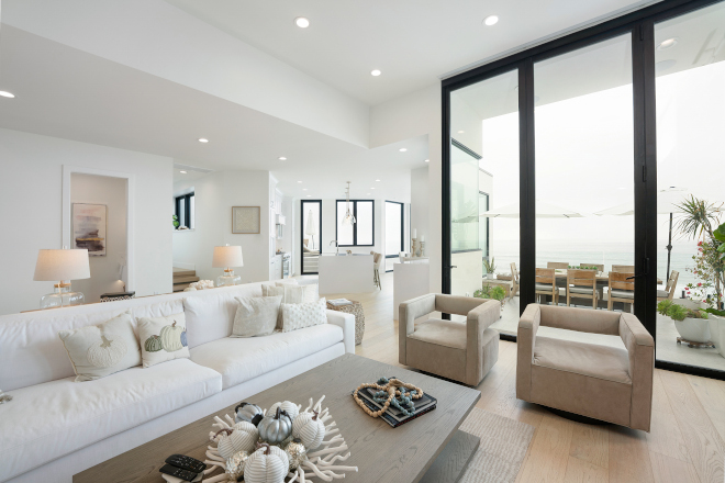 The floor to ceiling windows make this space light and bright while giving way to an incredible ocean view #doors #oceanview #beachhouse #view