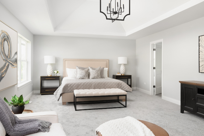 The spacious master bedroom is furnished with a vaulted ceiling for an open and airy feel for a room made to be a sleeping sanctuary #masterbedroom #bedroom
