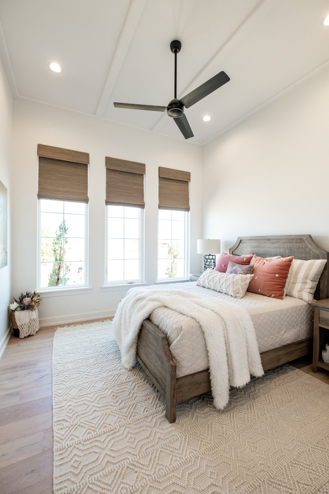 This bedroom has a rectangle panel style ceiling that reflects the three windows on the front wall of the bedroom #bedroom #ceiling #windows