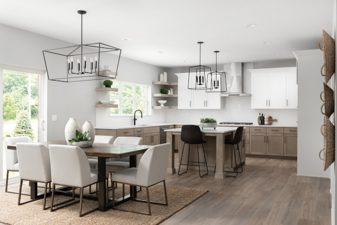 This kitchen is equipped with professional stainless-steel appliances an oversized kitchen island custom cabinets a large walk-in pantry and a spacious breakfast room #kitchen #breakfastroom #kitchendesign