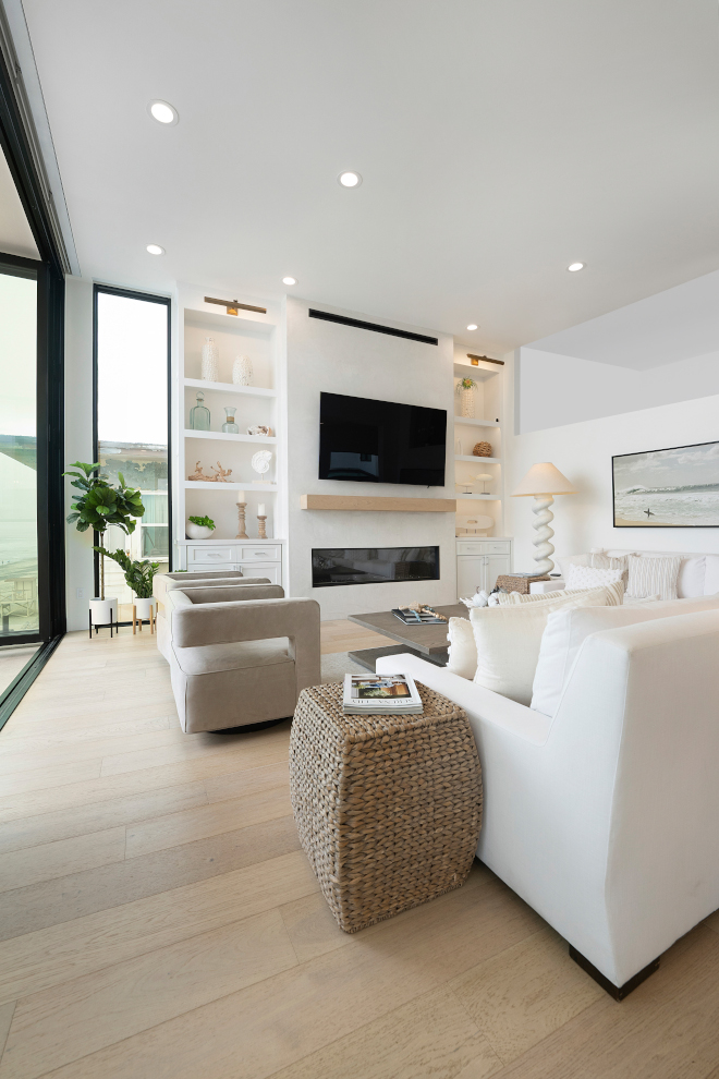 This modern coastal living room is very inviting with an open-concept design that boasts beauty and functionality #moderncoastal #livingroom #interiordesign