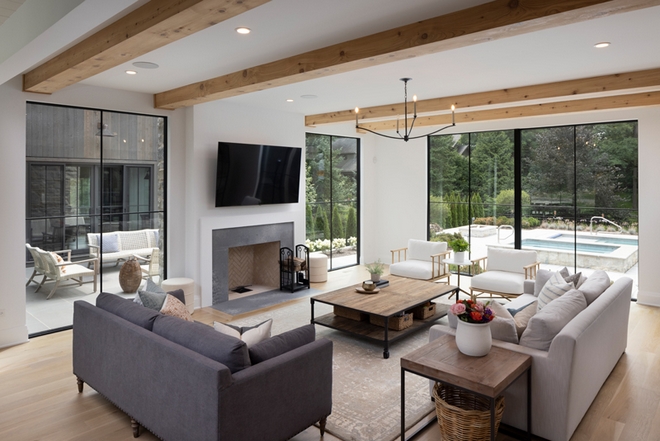 Living Room Oversized windows are the highlight of this room ensuring that interiors blend seamlessly with outdoor spaces Living Room Living Room #LivingRoom