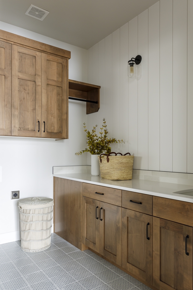 I always love to add a fun element in the laundry room This one in particular I added a tile to the floor that was inspired by vintage wallpaper and its ditsy pattern in navy and charcoal #laundryroom