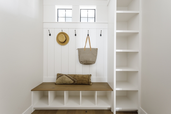 Mudroom features vertical shiplap behind the bench and custom cabinetry Mudroom features vertical shiplap behind the bench and custom cabinetry #Mudroom #verticalshiplap #bench #cabinetry