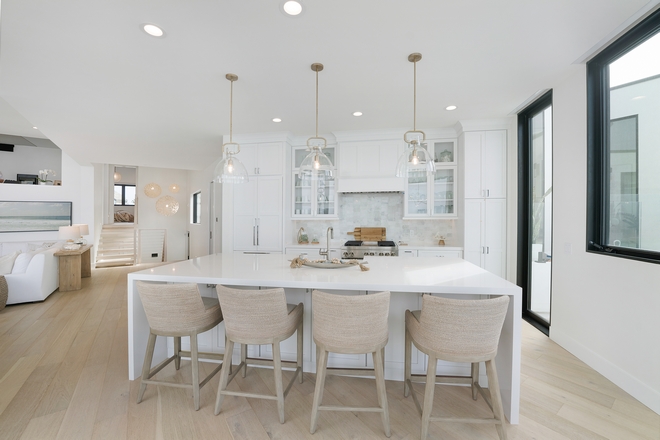 This light and bright kitchen is the epitome of coastal luxury with its stunning ocean views and modern aesthetic #kitchen #moderncoastalkitchen #kitchendesign #kitchenideas