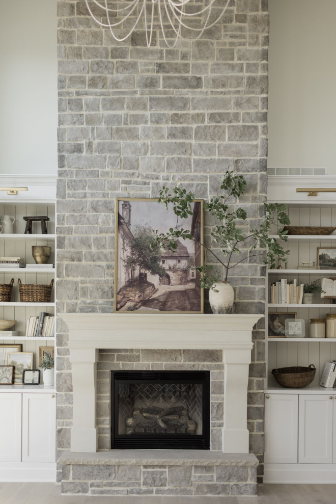 Grey stone fireplace The stone fireplace extends all the way up to the ceiling drawing your eye to yet another set of gorgeous barn wood beams Grey stone fireplace #Greystone #stonefireplace #fireplace