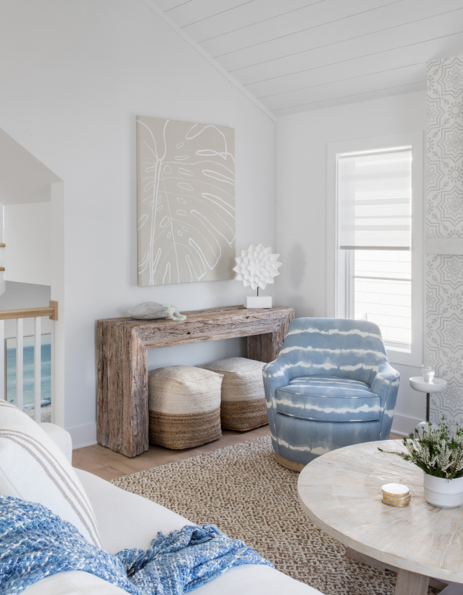 This living room combines textures and materials in a neutral palette with pops of coastal blue for a luxurious and comfortable scheme This living room combines textures and materials in a neutral palette with pops of coastal blue for a luxurious and comfortable scheme #livingroom #textures #materials #neutralpalette #coastal #blue #luxurious #scheme