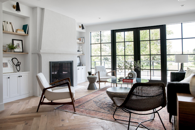 Living Room features custom built-ins a stunning fireplace and an eclectic yet comfortable vibe #LivingRoom #builtins #fireplace #eclectic #comfortable