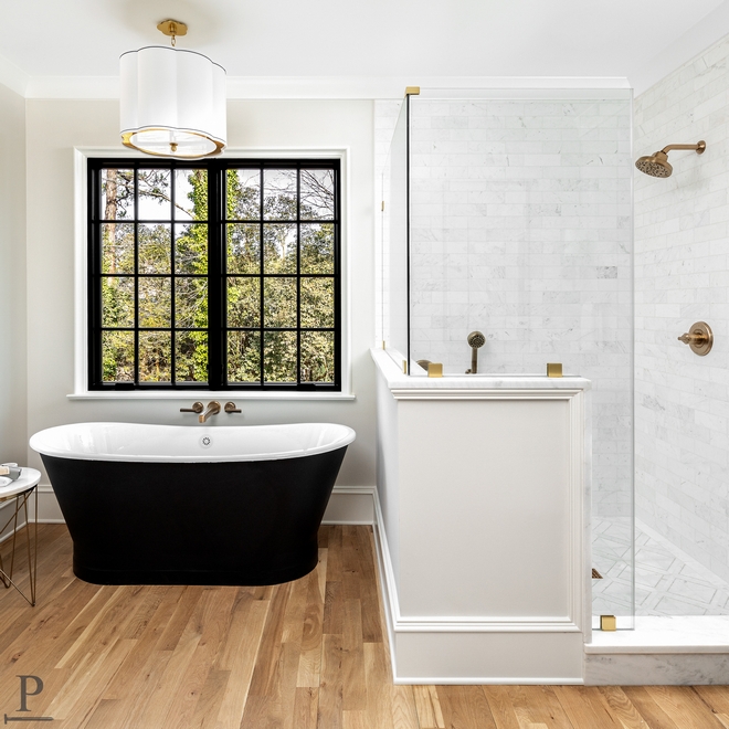 Bathroom Design Take special note of the accented skirted freestanding tub just off the shower with an elegant drum pendant to add dim light to evening soak #bathroomdesign #bathroom
