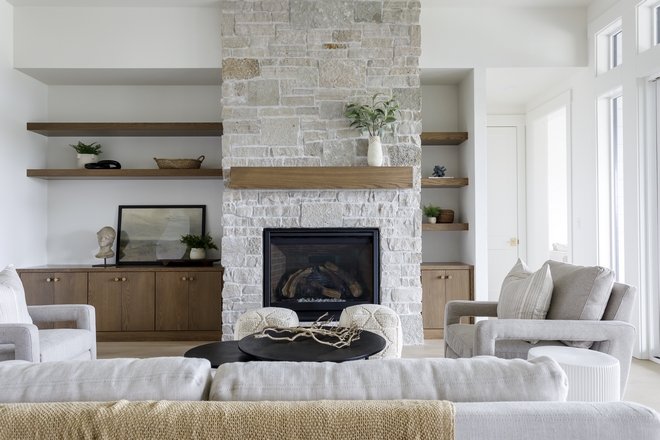 In our great room one of the features that stands out to us the most is the over-grouted Buechel Stone and stained mantle #stonefireplace #fireplace #stone #mantel