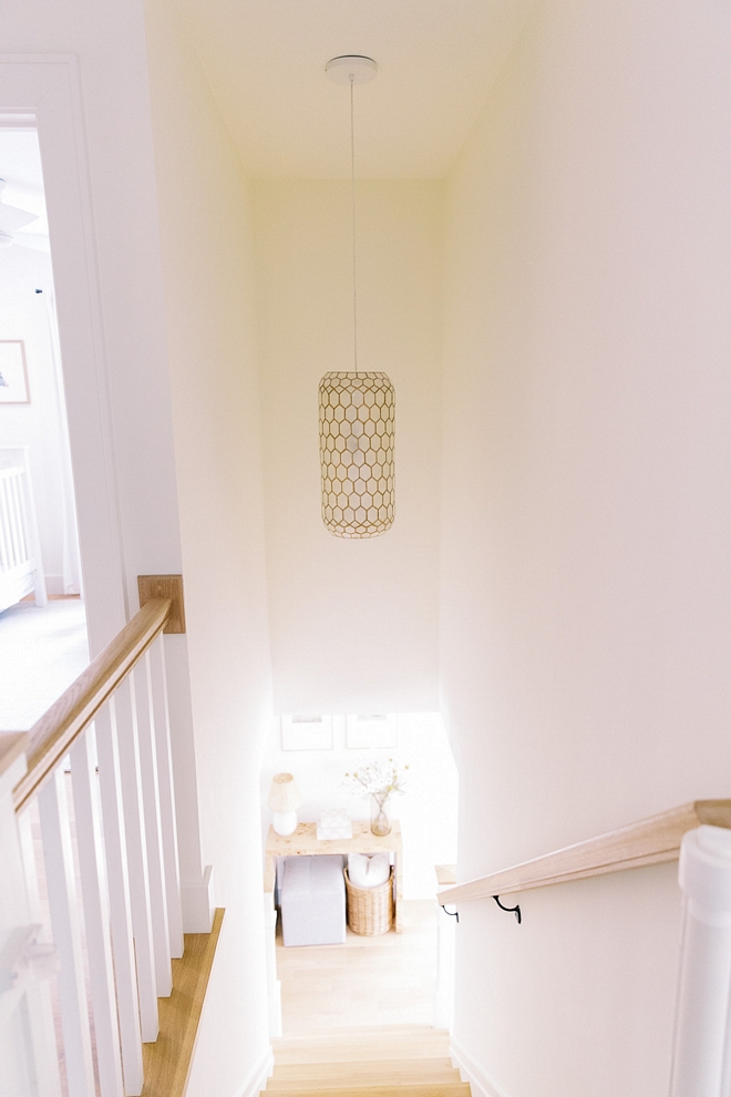 We rebuilt the stairs and chose square white oak stair treads that was stained to match the floors I love the modern touch this adds to our staircase #squarespindles #whiteoak #stairtread