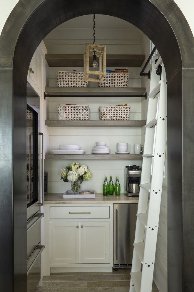 We wrapped the arched pantry door and barn door casing in the steel creating a bold feature that really draws your eye to those areas We wrapped the arched pantry door and barn door casing in the steel creating a bold feature that really draws your eye to those areas #pantry