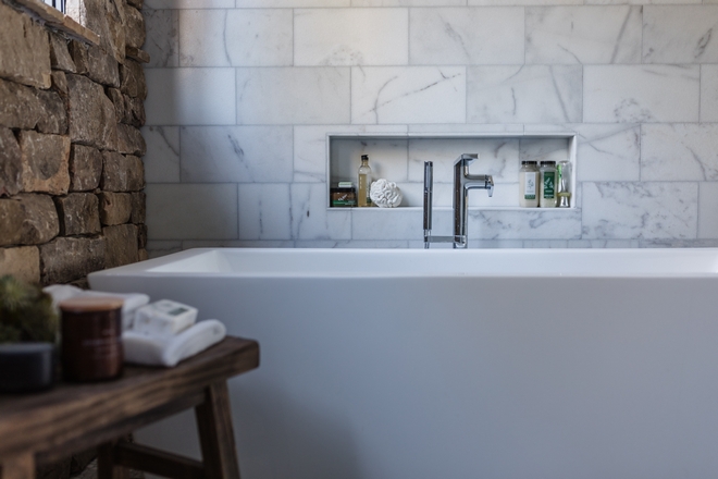 Bathroom with stone wall and marble tile