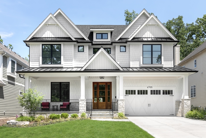 Modern Farmhouse This custom Family Home features everything you could wish for in a Modern Farmhouse an inviting front porch beautiful roof lines and of course, a white exterior with black windows #Modernfarmhouse #frontporch #rooflines #whiteexterior #blackwindows