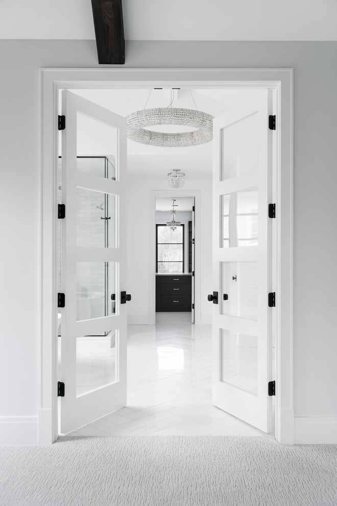 Double doors lead you into the spacious Primary Bathroom and Dressing Room