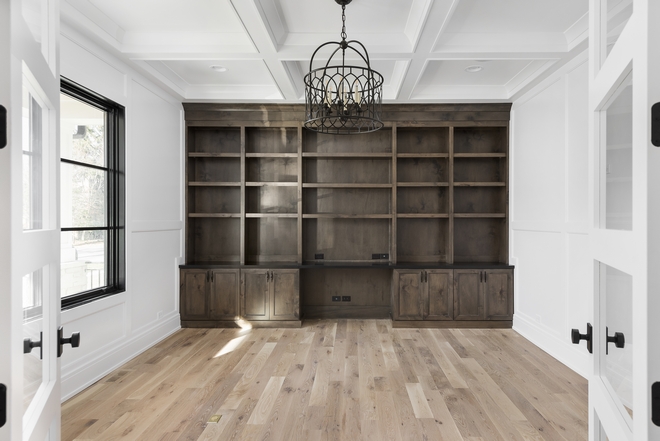 This large Home Office is located just across from the Foyer and it features custom cabinetry