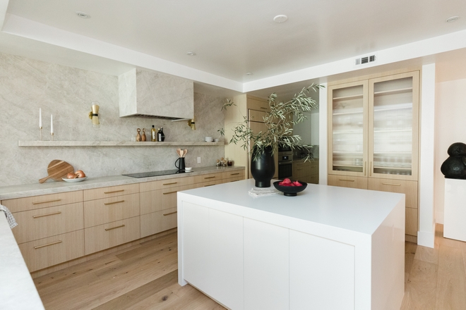 Kitchen was recently renovated and it now features custom White Oak cabinets along with a sleek slab hood #kitchen #Kitchenrenovation #renovatedkitchen #WhiteOakkitchen #kitchencabinet #slabkitchenhood