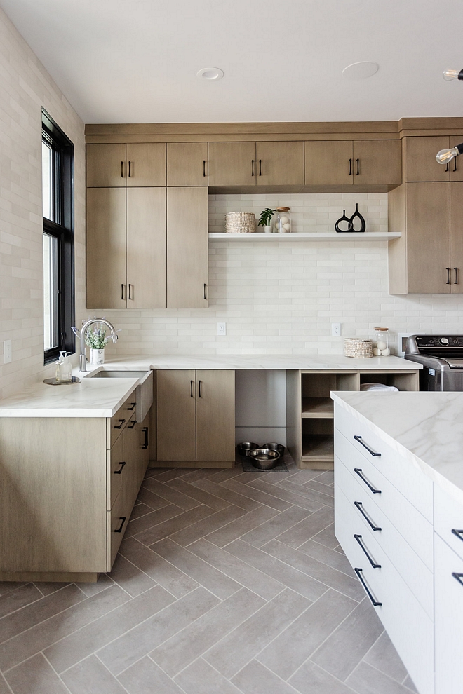 Neutral Laundry Room with White Oak Cabinet and Herringbone Rectified Tile Neutral Laundry Room with White Oak Cabinet and Herringbone Rectified Tile #NeutralLaundryRoom #WhiteOakCabinet #Herringbonetile #RectifiedTile