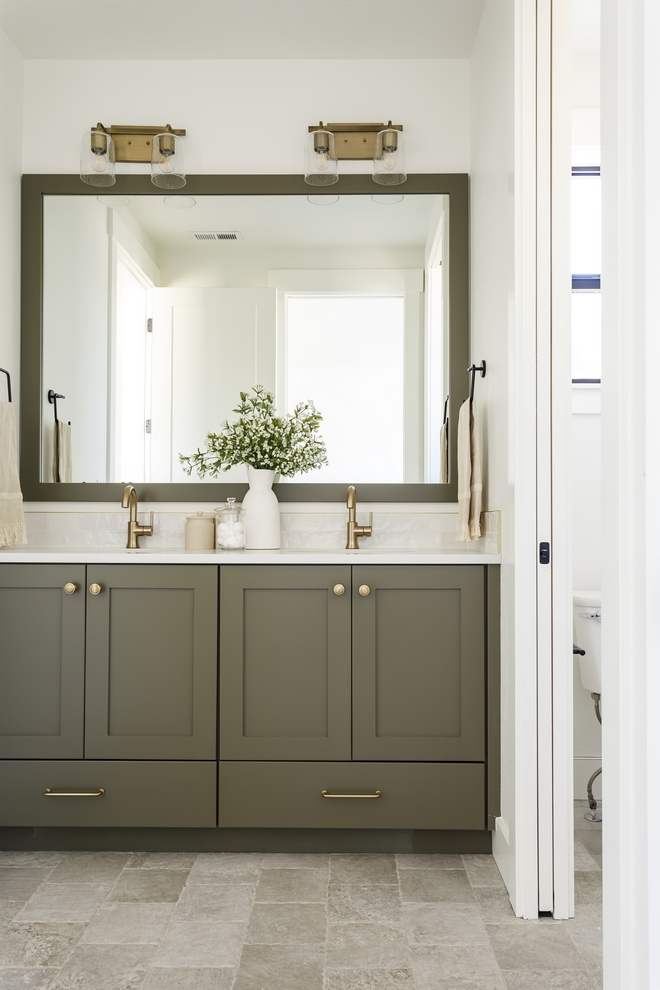 This stone look in a porcelain on the floor is such a win The variation and chiseled edge was the exact amount of rustic and refined that I was looking for in this shared bath #bathroom #tile