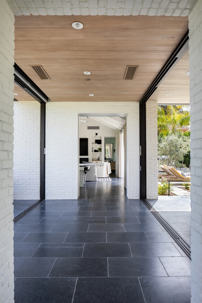 Breezeway Pocket doors in the breezeway between the kitchen and pool house really blur the lines between indoor an outdoor spaces #breezeway