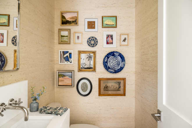 Powder Room features an art gallery wall by various artists from local art gallery #powderroom #artgallery