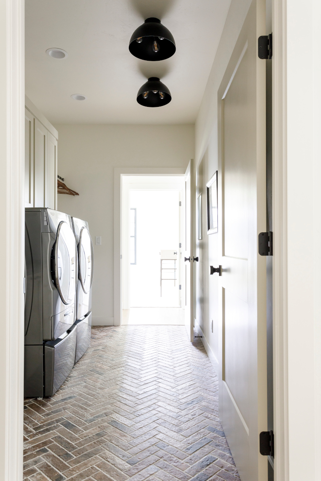 Laundry Room with tile floor that mimics brick and quartz countertops that mimic soapstone #laundryroom