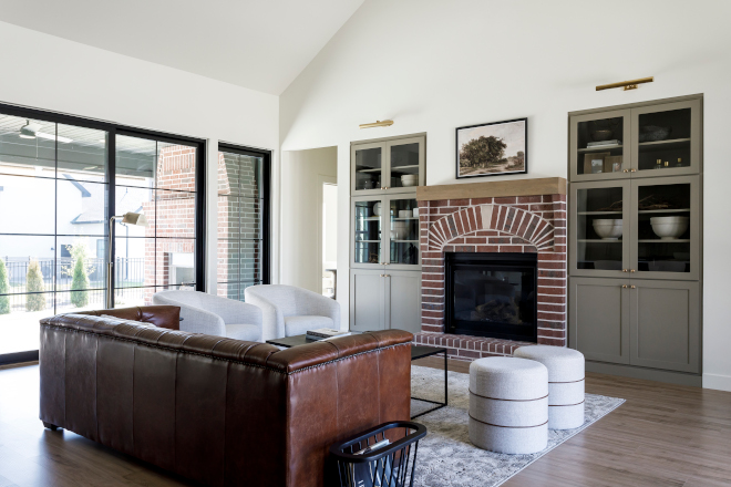 The great room is anchored by our custom designed mason fireplace and flanked by two beautiful built ins #greatroom #builtins