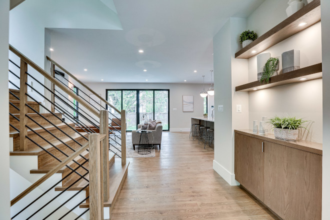 The main hall features a custom built-in cabinet with floating shelves #builtin