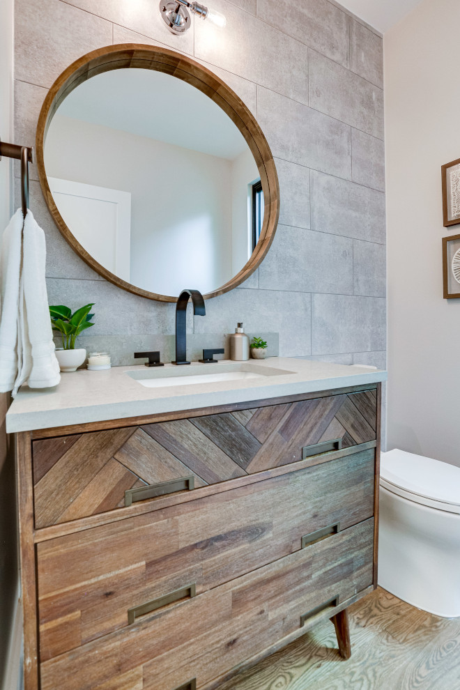 The powder room once again utilizes a sleek concrete tile which is then counterbalanced by the warmth and texture of the vanity #Powderroom #vanity #concretetile #tile