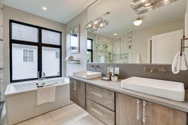 Utilization of dramatic shower wall tile allowed for the remainder of this bathroom to remain clean and simple #bathroom