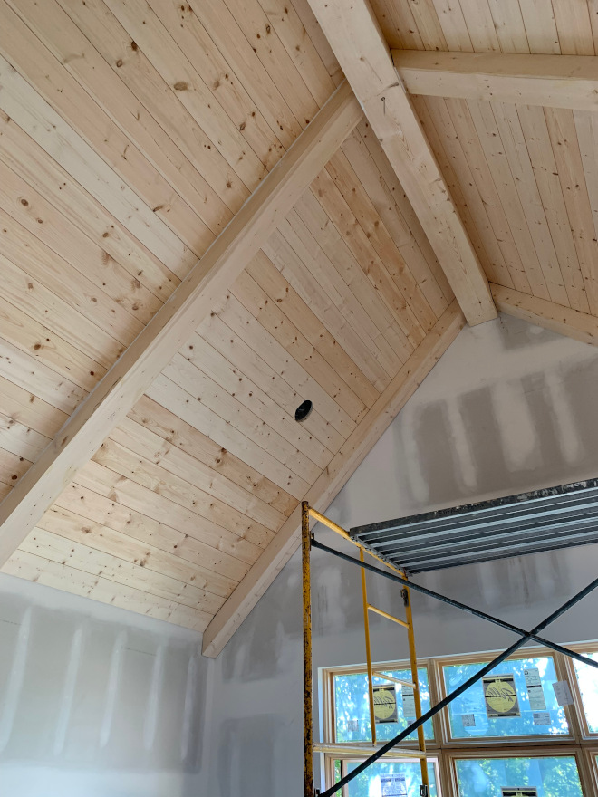 One of the things I love most about our bedroom is the shiplap and beams on the ceiling