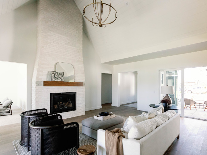 Great Room features vaulted ceiling with shiplap paneling in Sherwin Williams Alabaster #shiplappaneling #SherwinWilliamsAlabaster