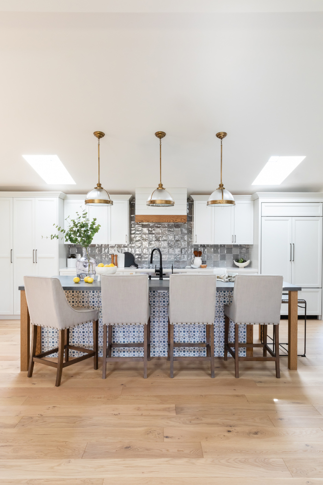 Kitchen island tile The kitchen island is accentuated by a stunning tile while white perimeter cabinets keep things calm #kitchenisland #kitchen #tile