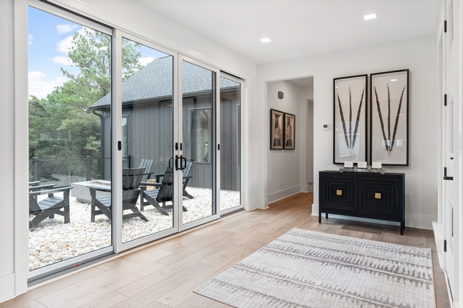 Foyer with view The front door opens into a bright foyer facing an inviting courtyard with firepit #Foyer #view #courtyard