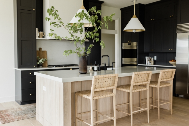 White Kitchen with Stacked Cabinets and Grey Island - Home Bunch