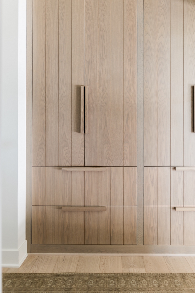 The lockers are White Oak with our custom white wash stain on them The hardware is also custom made out of White Oak Cabinetry is inset