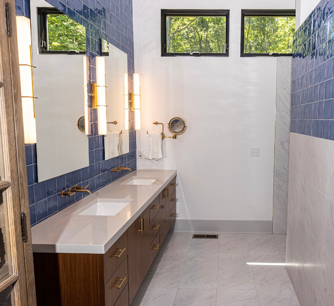 I wanted to add some more blue into the first floor so I went with this blue handmade tile which extends from floor to ceiling behind the floating vanity #bathroom #bluetile