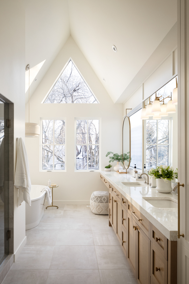 Neutral Bathroom Vaulted ceilings along with a neutral color-scheme make this bathroom feel calm and inviting #neutralbathroom #neutrals #bathroom