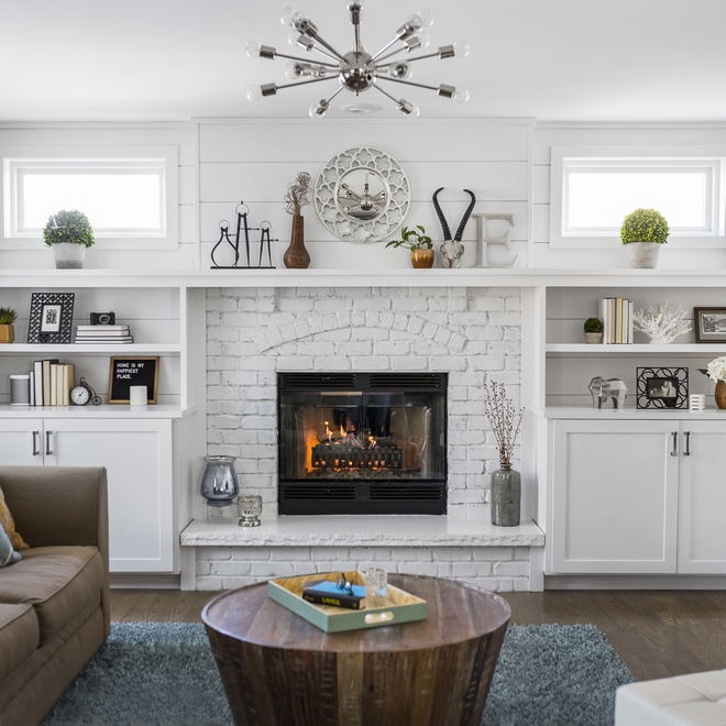 In the Family Room the designer added the transom windows on either side of the fireplace to bring in more natural light