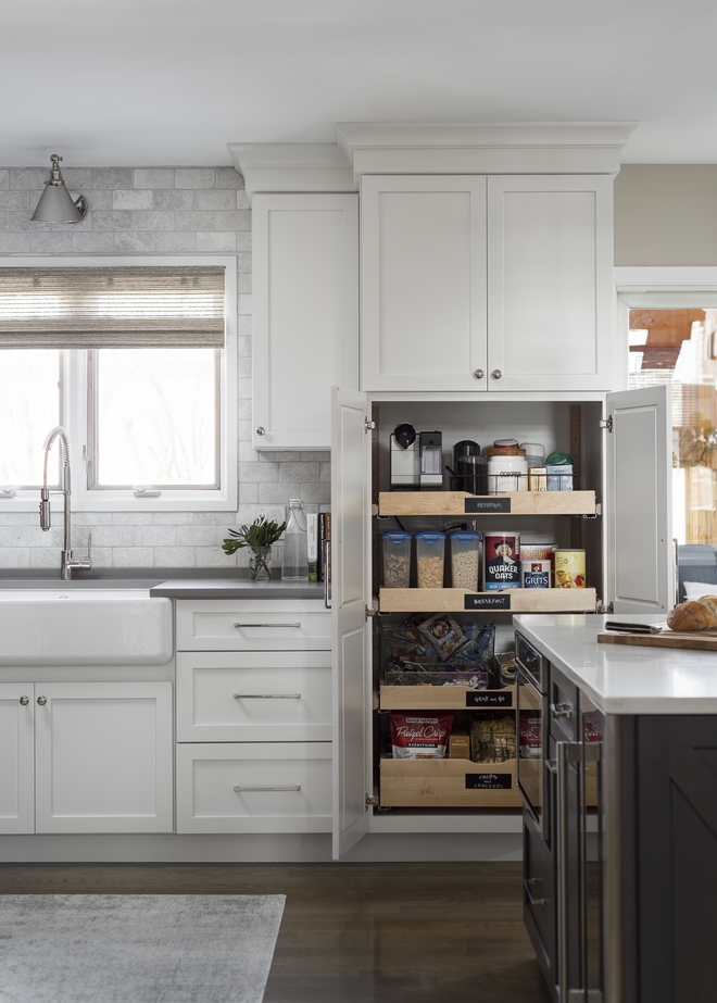 This newly-renovated kitchen features a pantry cabinet with pull-out shelves