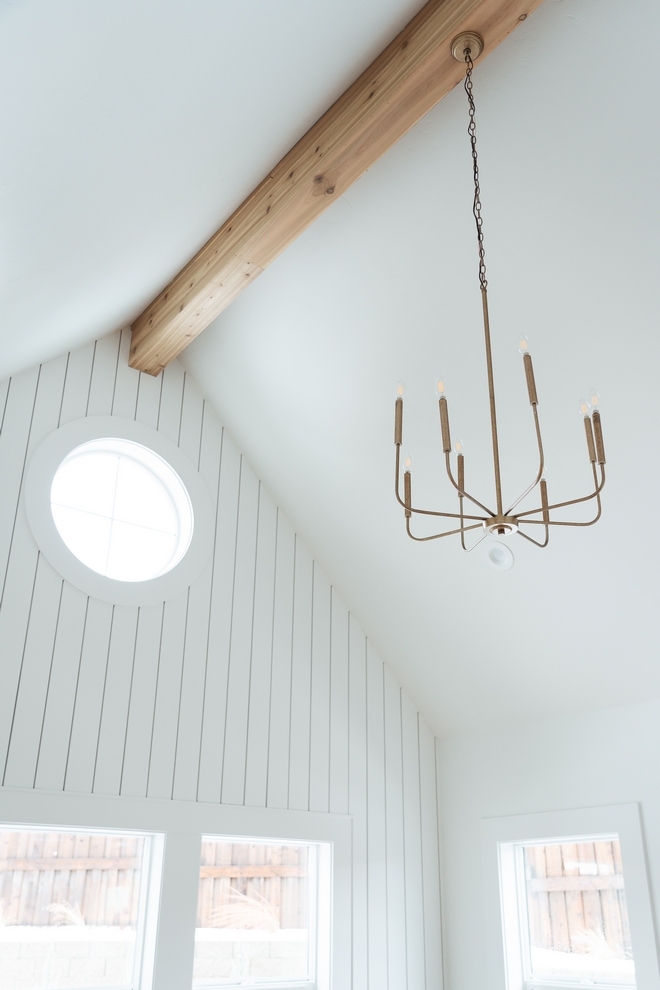 Bedroom Millwork Stain Grade Center Beam along vault and Vertical Shiplap Sherwin Williams Pure White SW 7005 window wall in bedroom