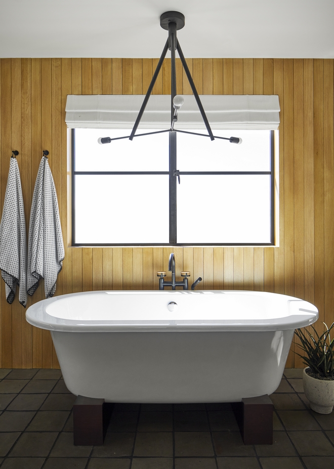A wall clad in White Oak paneling gives plenty of texture and helps add serenity and warmth to this Primary Bathroom