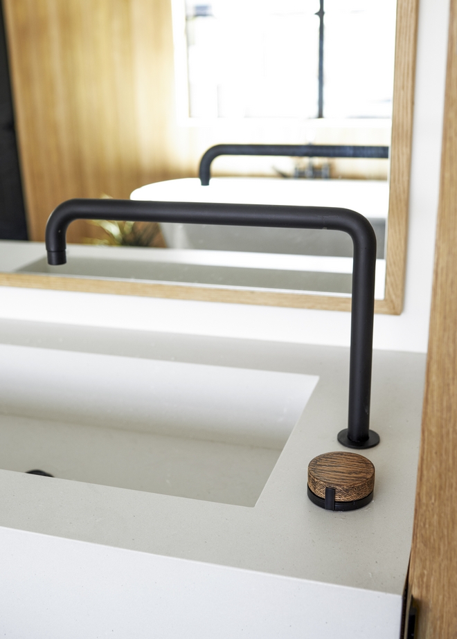 Bathroom integrated sink with oversized faucet