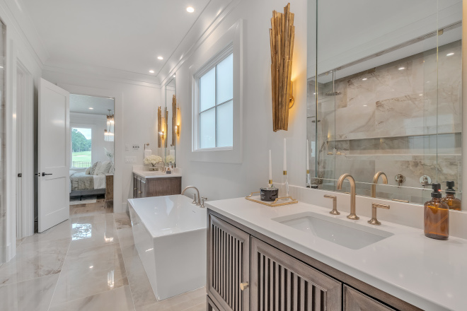 The primary bathroom is a stunning space The oversized shower features a niche that runs the length of the back wall #primarybathroom #shower